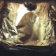 A woman shits into a pan lined with aluminum foil. It is a long turd that curls as it slides out. Product shown in its entirety. Brief video. See movie 9611 for similar content. Over half a minute.